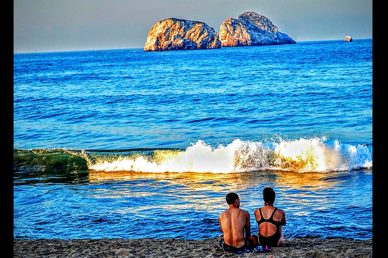 Couple Sitting at Beach Photo